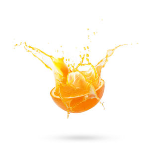 Close-up of yellow splashing water against white background