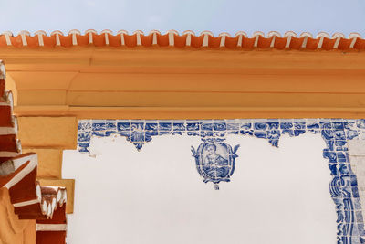 Low angle view of building against clear blue sky