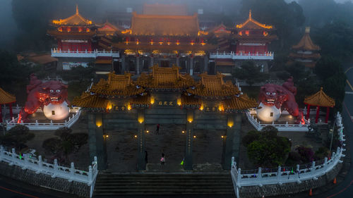 High angle view of illuminated buildings at temple