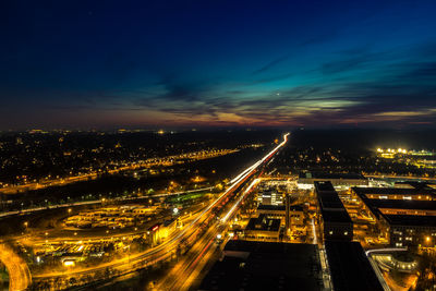 High angle view of light trails on highway at night