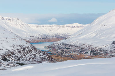 Scenic view of snowcapped mountains against sky