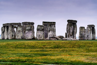 View of old ruin building on field against sky