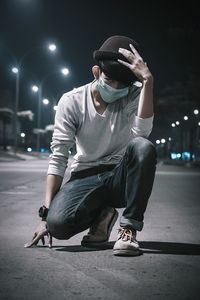 Young man with surgical mask outdoors