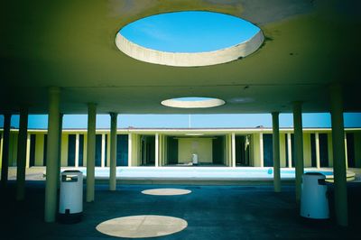 Circle shaped sunlight falling on floor from ceiling