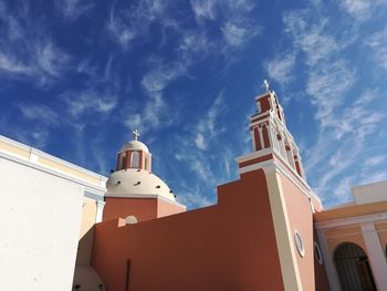 Low angle view of bell tower against sky