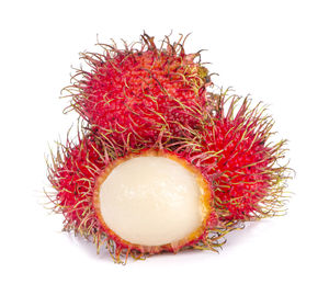 Close-up of strawberry over white background