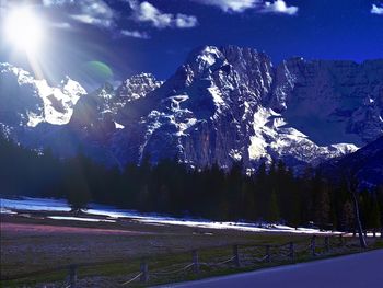 Scenic view of snowcapped mountains against sky during winter