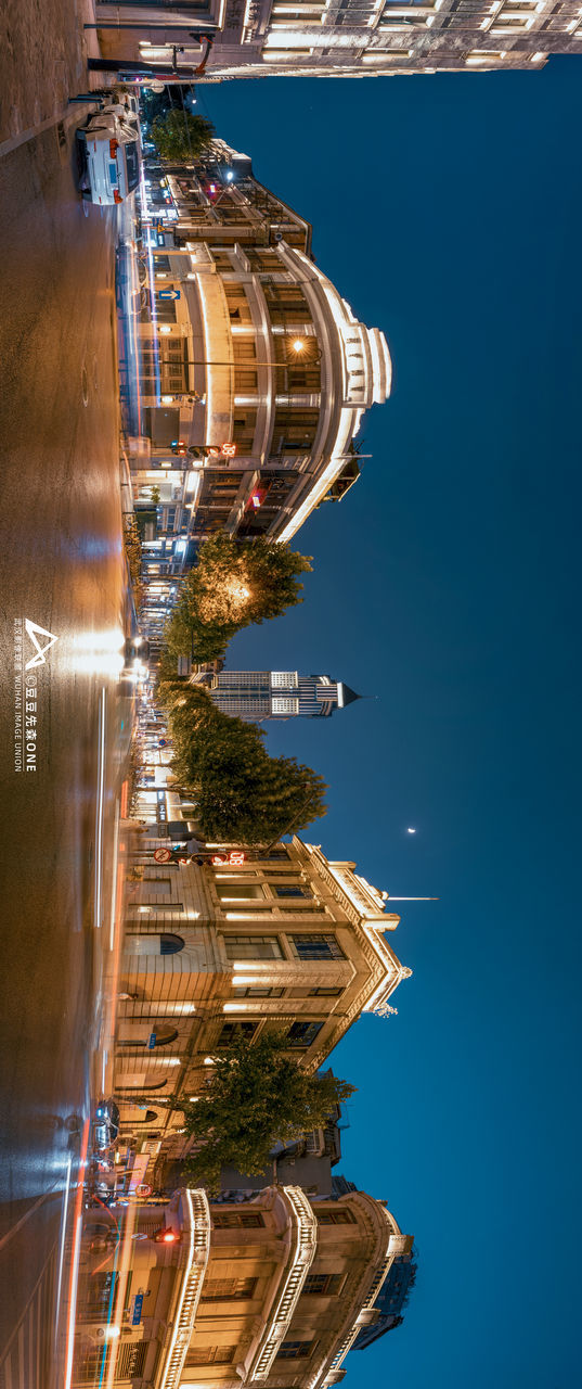 reflection, architecture, landmark, city, built structure, building exterior, night, travel destinations, water, nature, no people, building, travel, tower, blue, illuminated, cityscape, sky, transportation, outdoors, skyscraper, screenshot, tourism, aerial view, office building exterior