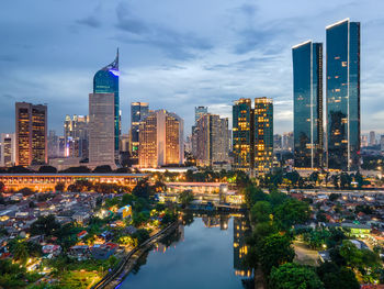 Illuminated buildings in city at night