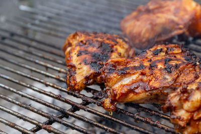 High angle view of meat on barbecue grill