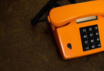 Close-up of telephone on table