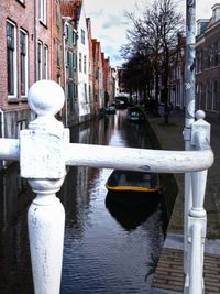 Canal amidst buildings in city