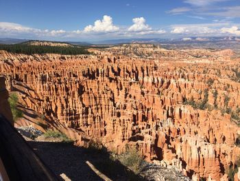 Scenic view of landscape against cloudy sky