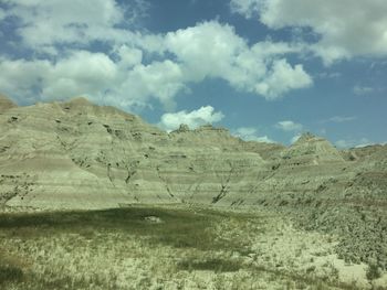 Scenic view of arid landscape against sky