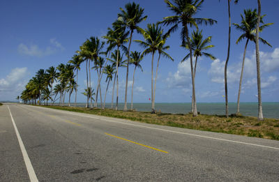 Road by sea against sky