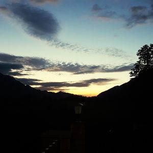 Silhouette mountains against sky during sunset