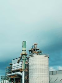 Low angle view of factory against sky