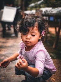 Portrait of cute girl holding woman