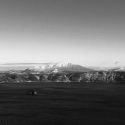 Scenic view of snowcapped mountains against clear sky