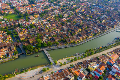 High angle view of townscape by river