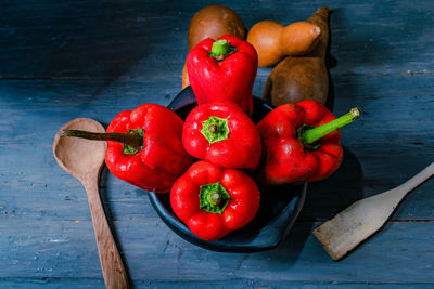 High angle view of tomatoes on wooden table