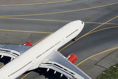 Aerial view of plane at airport. airplane taxiing to runway before take off.