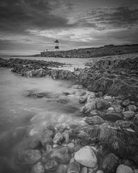 Scenic view of sea against cloudy sky