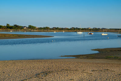 Scenic view of sea against clear blue sky