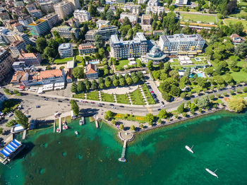 High angle view of swimming pool by buildings in city