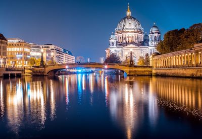 Reflection of illuminated buildings in water at night