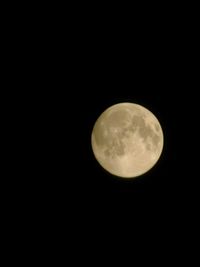 Scenic view of full moon against sky at night