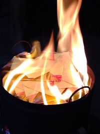 Close-up of fire in dark room