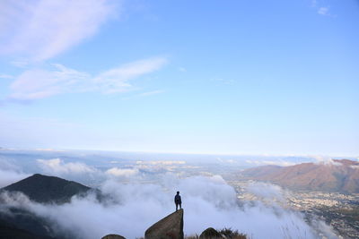 Scenic view of mountains against cloudy sky