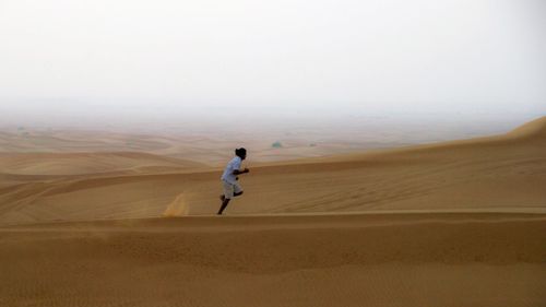Full length of woman in desert