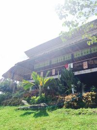 Built structure with trees in foreground