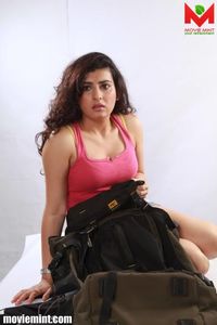 Portrait of a young woman sitting outdoors
