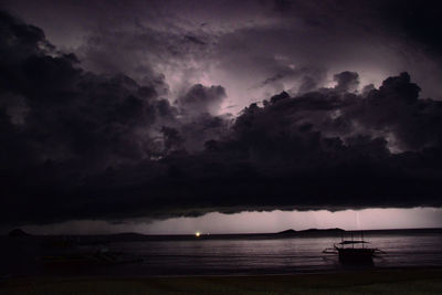 Scenic view of sea against dramatic sky