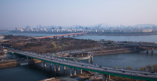 High angle view of bridges in city against clear sky