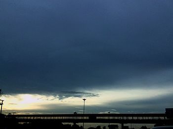 Low angle view of building against cloudy sky