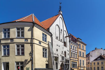 Low angle view of building against clear blue sky