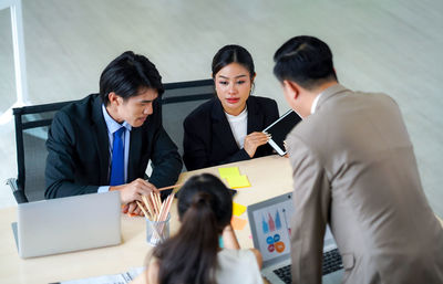 Business colleagues working at office