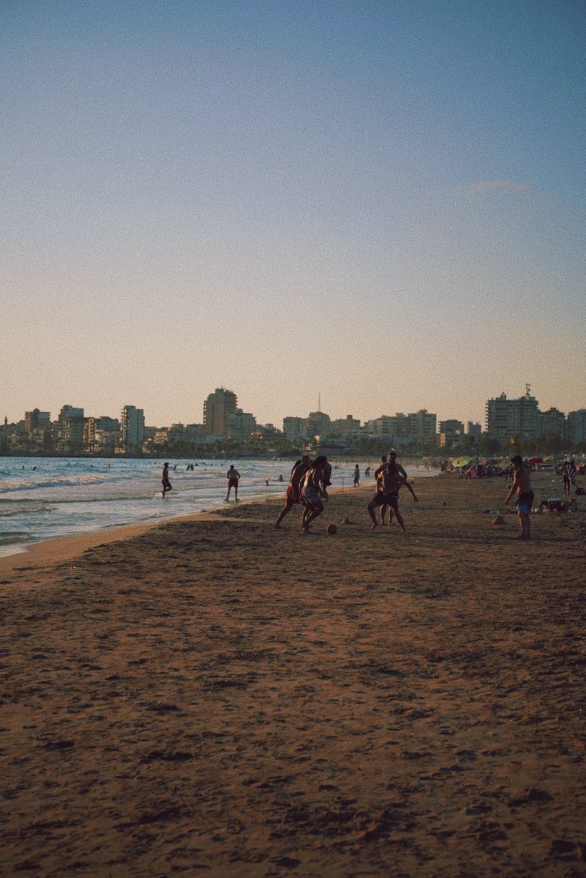 GROUP OF PEOPLE ON BEACH