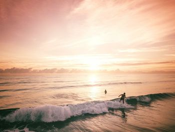 Scenic view of sea against sky during sunset