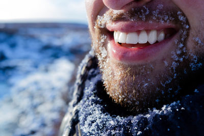 Close-up of mid adult man by sea