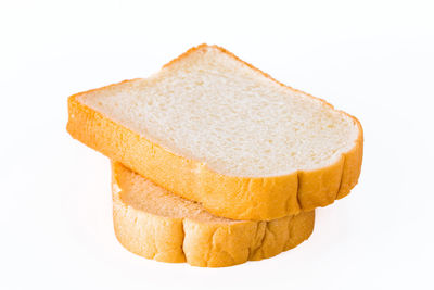 Close-up of bread against white background