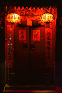 Illuminated lantern hanging at night