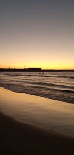 Scenic view of sea against clear sky during sunset