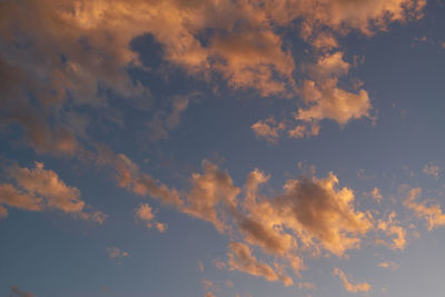 Low angle view of cloudy sky during sunset