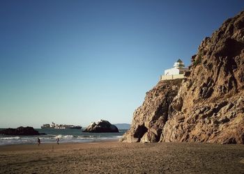 Scenic view of sea against clear blue sky