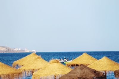 Panoramic view of beach against clear sky